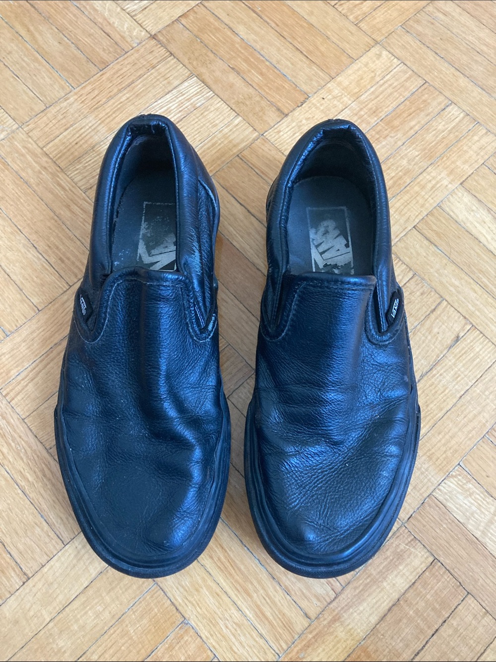 Vans Women’s Black Leather Slip-On Flats